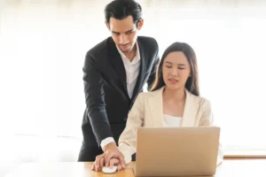 A man’s hand placed over a woman’s hand