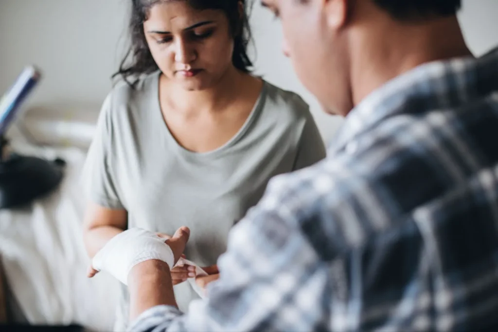A woman is being bandaged.