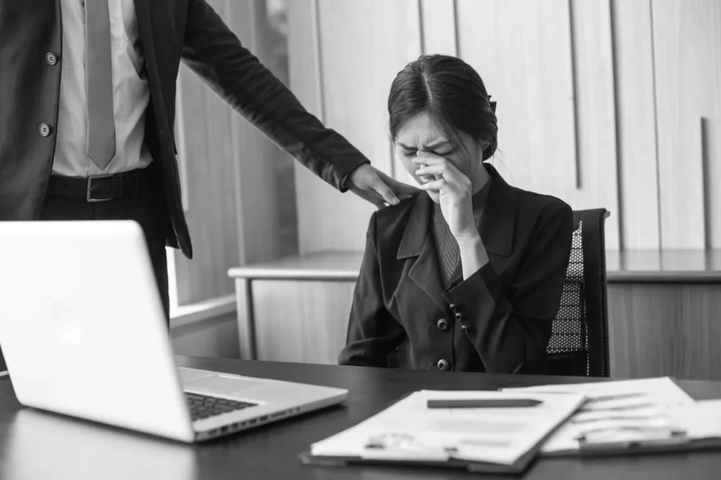 A woman at the workplace crying