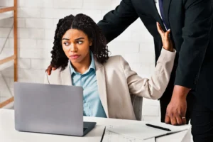 A woman resisting a man at the workplace